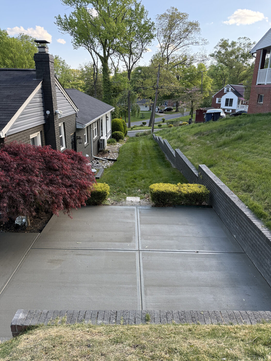 Driveway with a brick retaining wall border