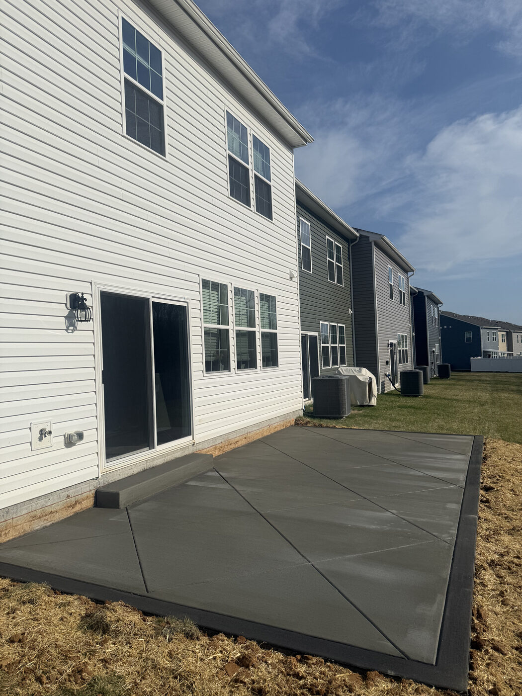 Concrete patio poured for a townhouse backyard