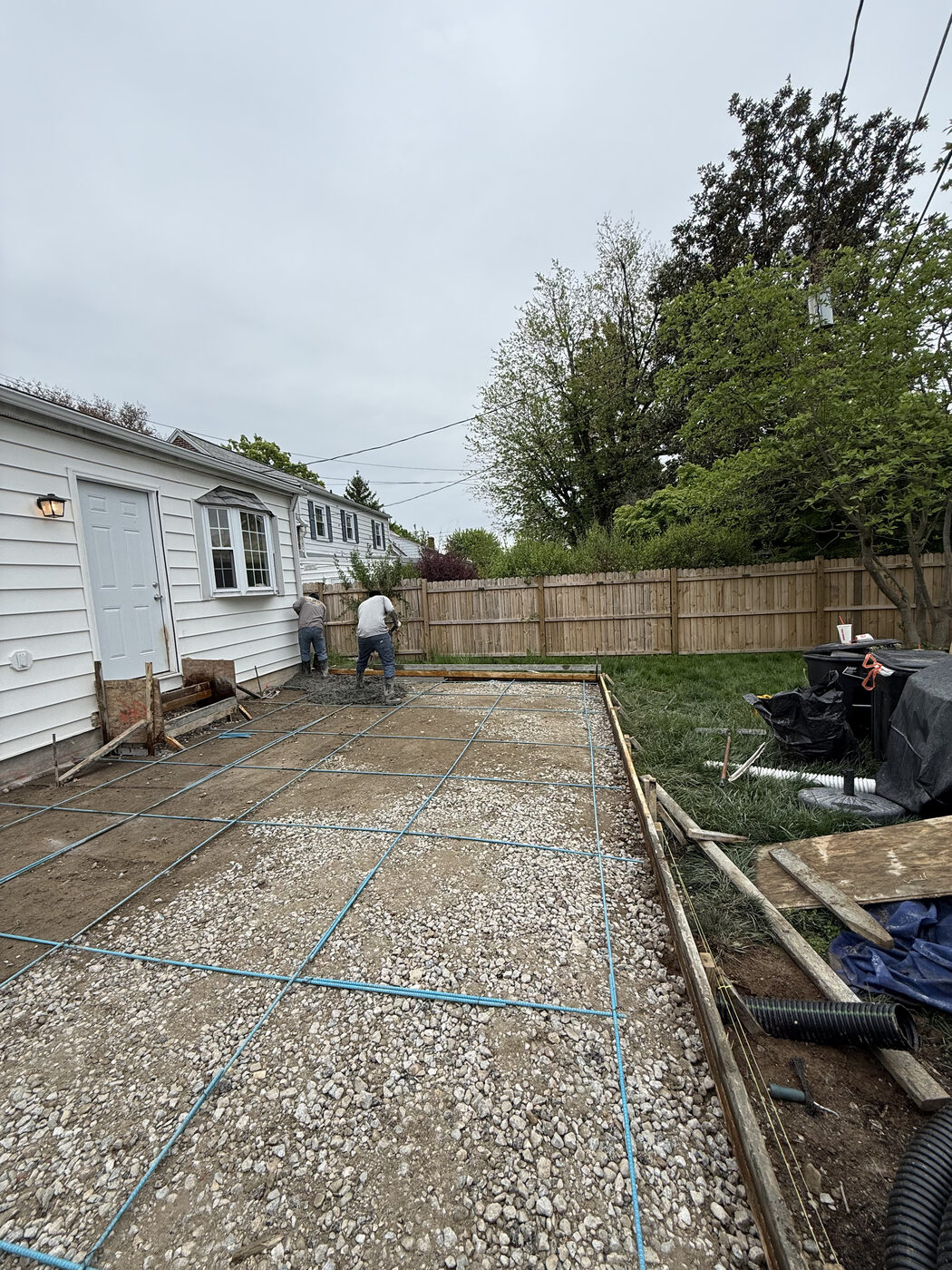 Crew setting rebar and wood forms before a concrete pour