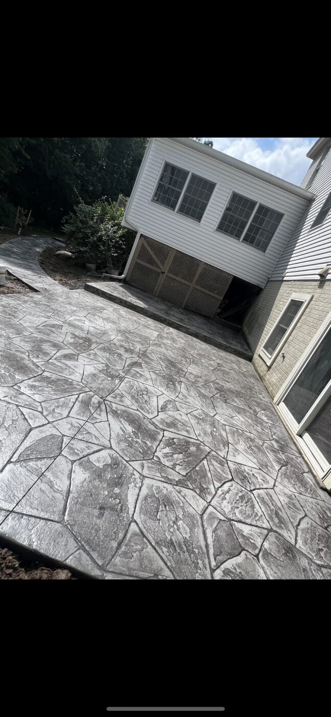 Gray stamped flagstone-pattern concrete patio
