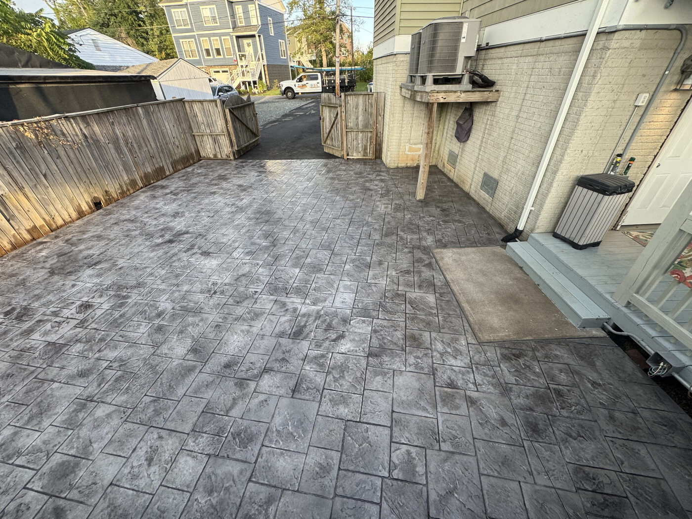 Stamped concrete patio in a compact urban backyard