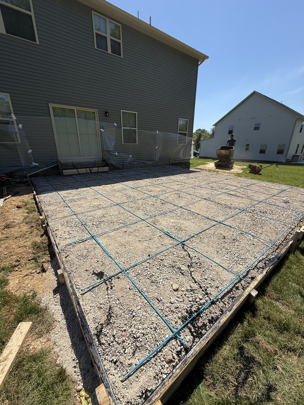 Rebar reinforcement grid set before a concrete patio pour